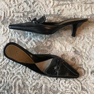 Size 7.5 black mules.  2 inch heel. Worn 1 time.